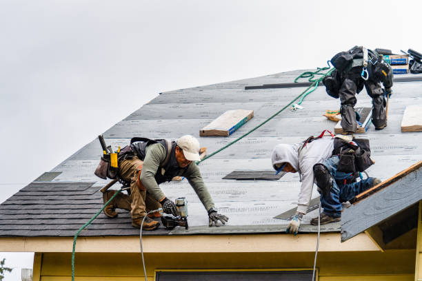 Professional Storm Damage Roof Repair technician working in Peace Dale, RI